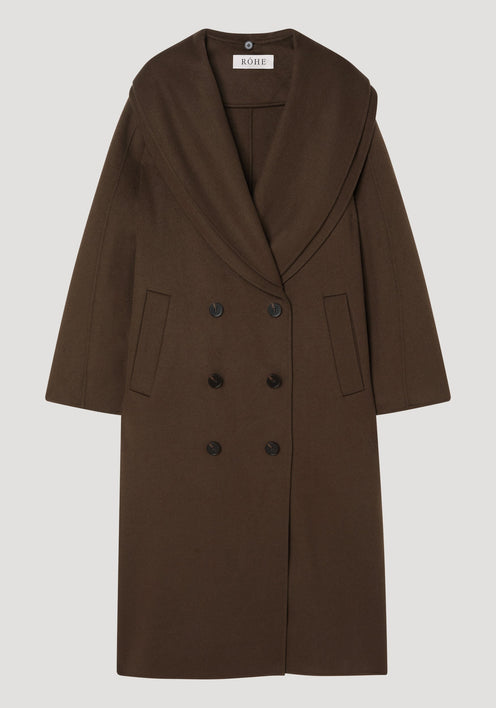 Signature double-faced scarf coat with a double-breasted design, wide shawl collar, and welted pockets. Made from 100% wool, featuring a distinctive double-layered scarf collar.