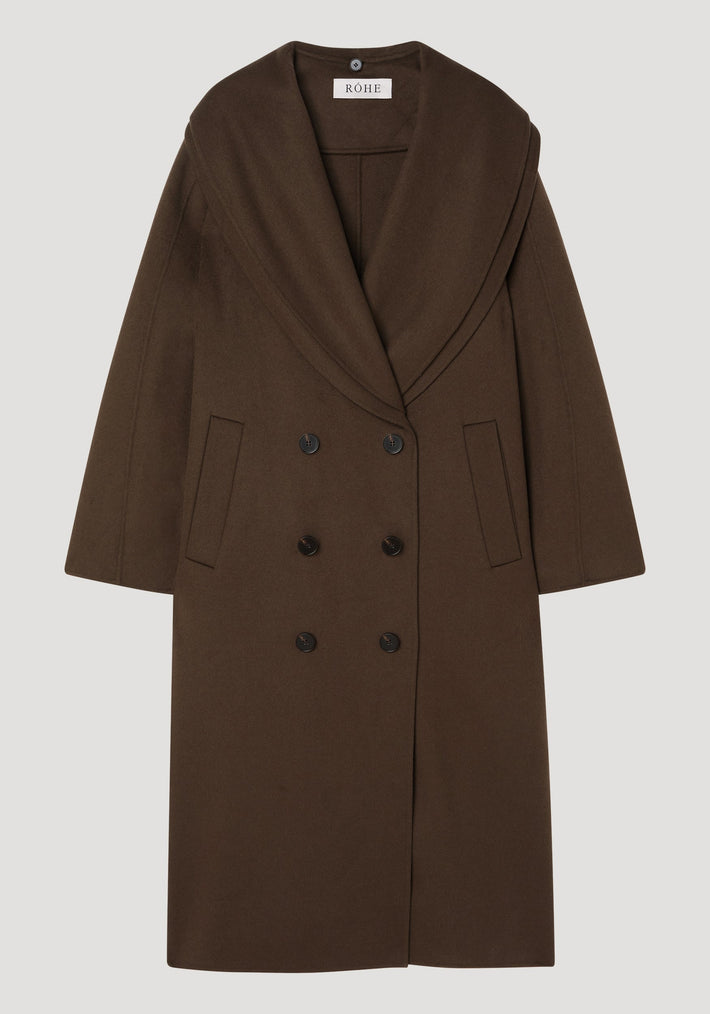 Signature double-faced scarf coat with a double-breasted design, wide shawl collar, and welted pockets. Made from 100% wool, featuring a distinctive double-layered scarf collar.