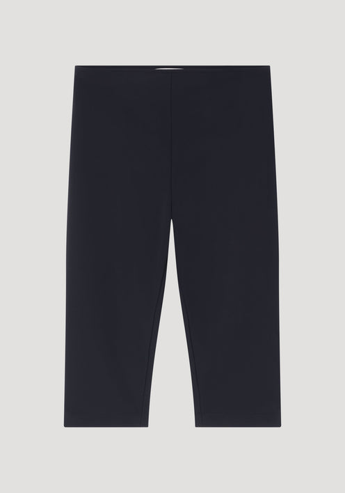 Scuba capri | black: Solid-black, mid-thigh stretch shorts with a flat waistband, crafted from heavyweight scuba fabric for a tailored, structured fit.