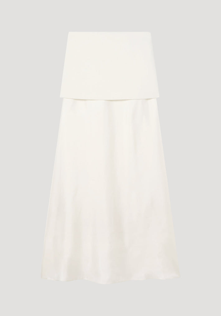 Integrated fluid silk skirt in cream, featuring a strapless bandeau top, high waist, flared silhouette, and blind side seam zip, combining wool and silk textures.