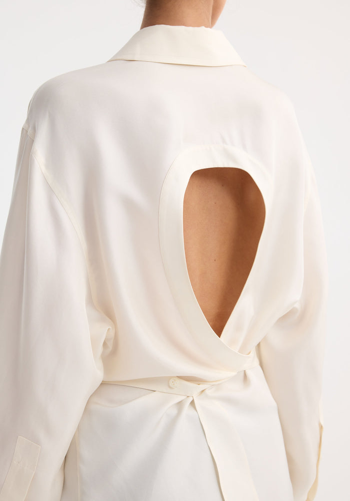 Back view of Deconstructed silk shirt | cream, featuring an open back with a tie closure for versatile styling, crafted from 100% flowing silk.