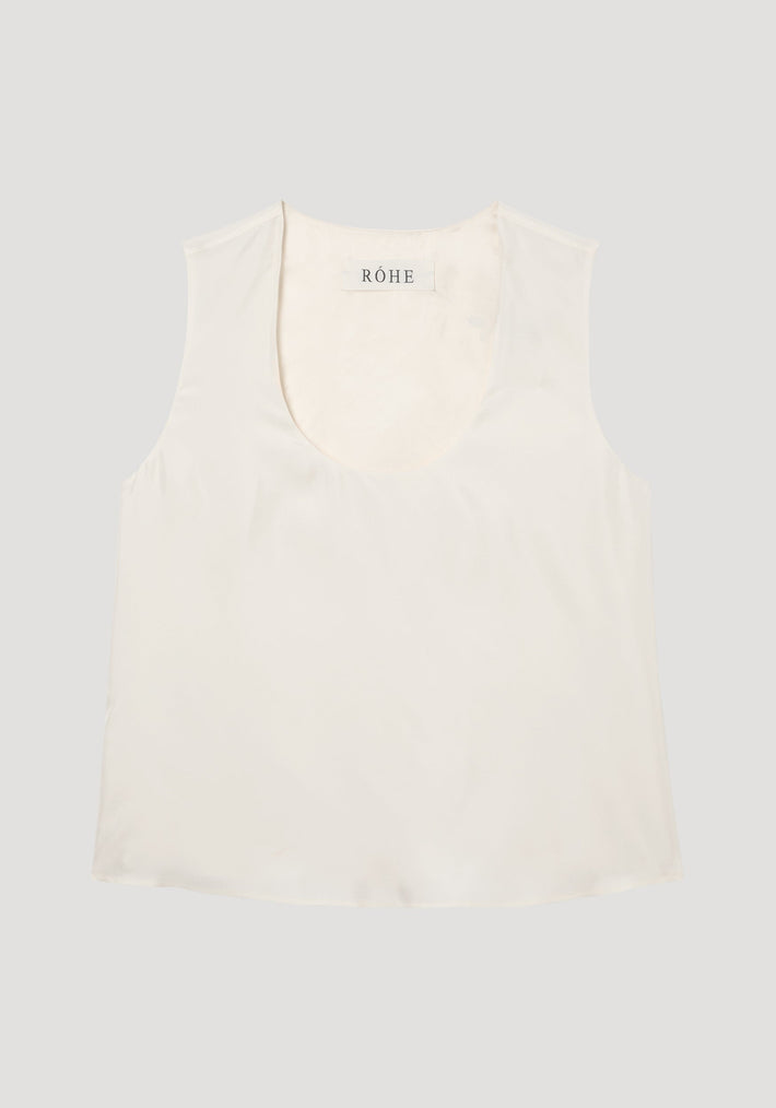 Scoop-neck silk top in cream, featuring a wide scooped neckline, sleeveless design, and loose fit. Made from 100% silk with a minimalist aesthetic.