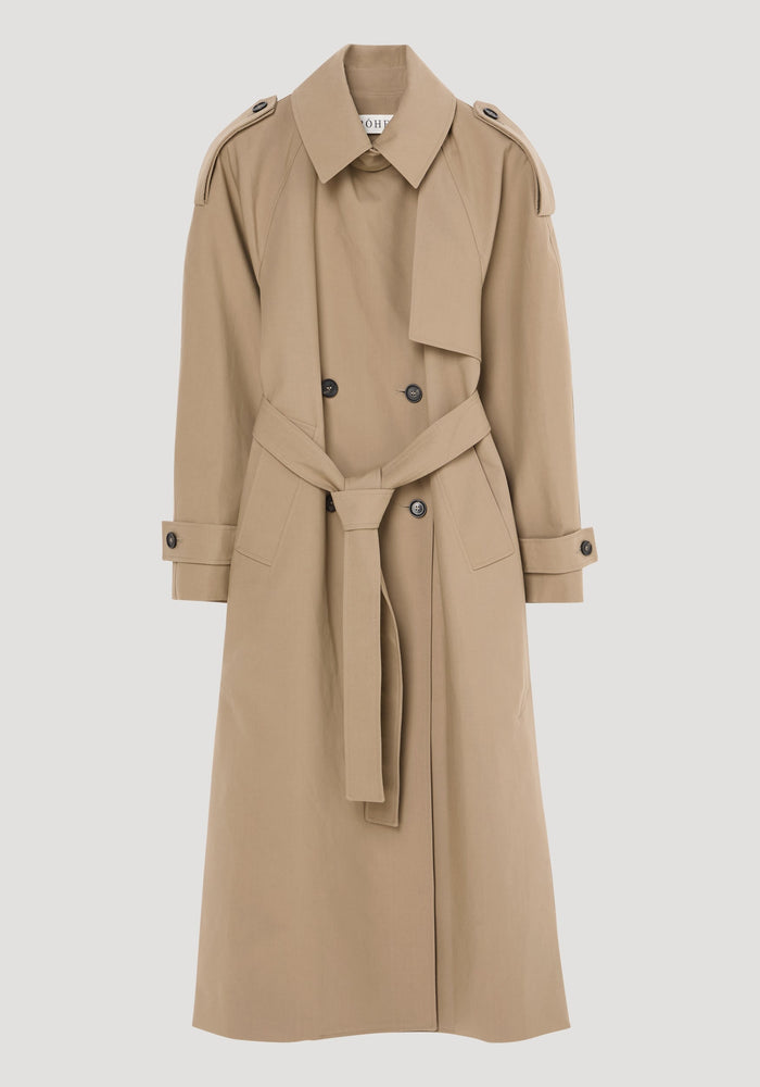 Oversized classic trench | clay: Light tan knee-length trench coat featuring a pointed collar, epaulettes, double-breasted front, self-fabric belt, and adjustable cuffs.