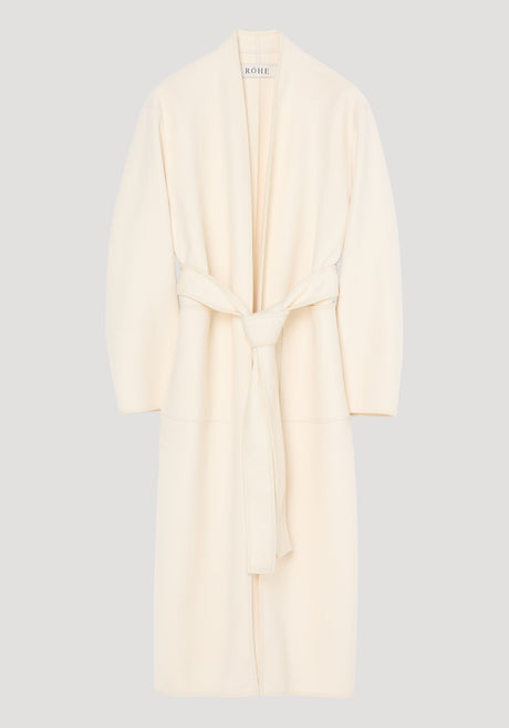 Double-faced kimono style coat in off white, featuring a calf-length wrap design with patch pockets, long sleeves, and a self-tie belt for an adjustable fit.