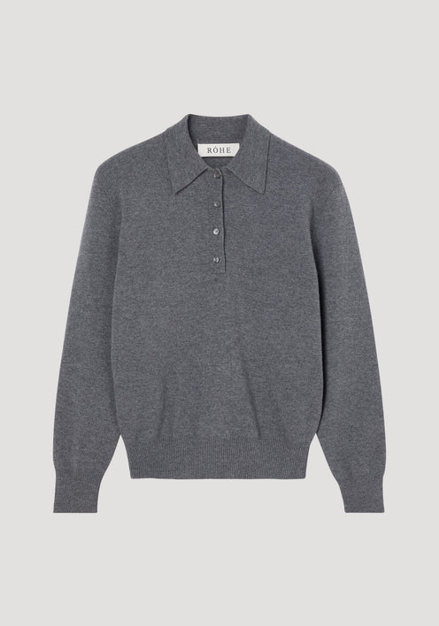 Compact knitted polo in mid grey melange, featuring a long-sleeve design, pointed collar, four-button placket, and ribbed cuffs, crafted from Italian wool-cashmere blend.