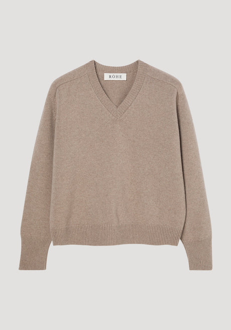 Sleeve wrap jumper in taupe melange, showing V-neck, ribbed cuffs and hem, relaxed fit. Crafted from a cashmere-wool blend, features twistable sleeves for versatile styling.