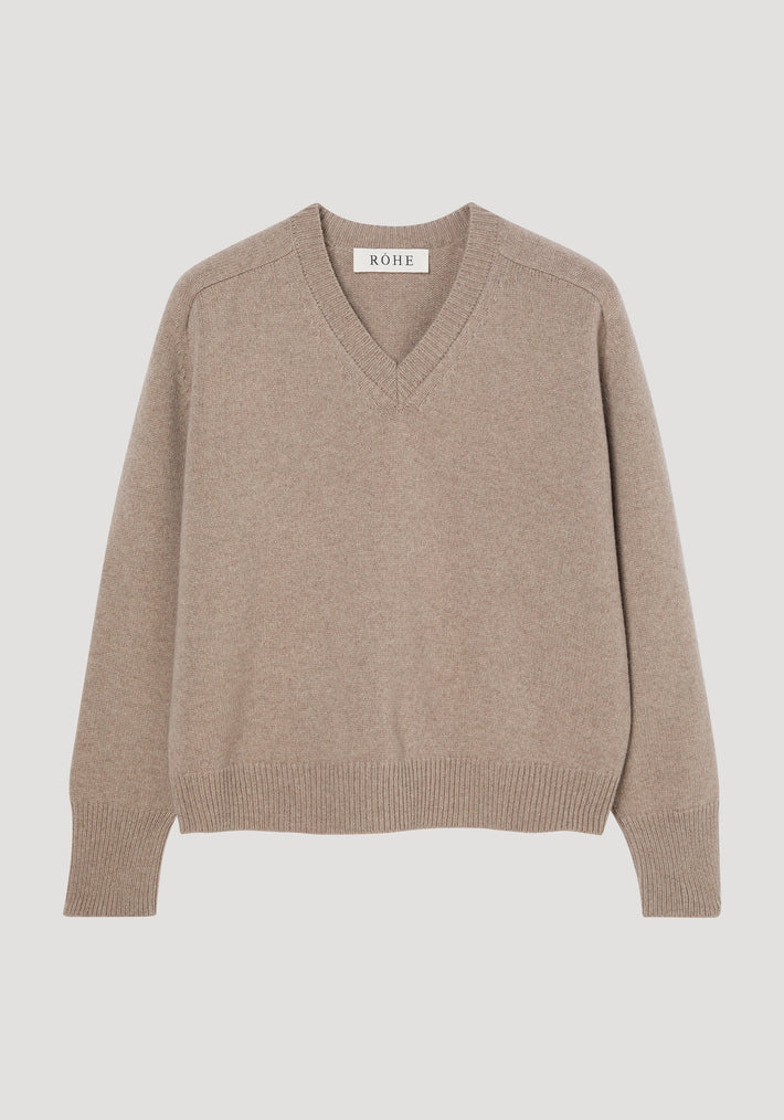 Sleeve wrap jumper in taupe melange, showing V-neck, ribbed cuffs and hem, relaxed fit. Crafted from a cashmere-wool blend, features twistable sleeves for versatile styling.