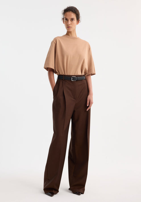 Mid-waist tailored trousers in a deep brown with wide legs, belt loops, and front pleats, crafted from a virgin wool and mohair blend.