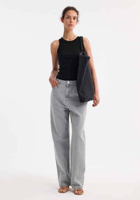 Signature baggy fit denim in mid grey, featuring a low-waist, wide-leg design, belt loops, front pockets, and a zip fly with button closure.