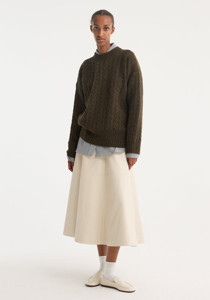 A-line leather skirt | chalk: Cream A-line midi skirt with croco embossing, soft leather, minimalist waistband, and horizontal panel seam, creating a subtly flared silhouette.
