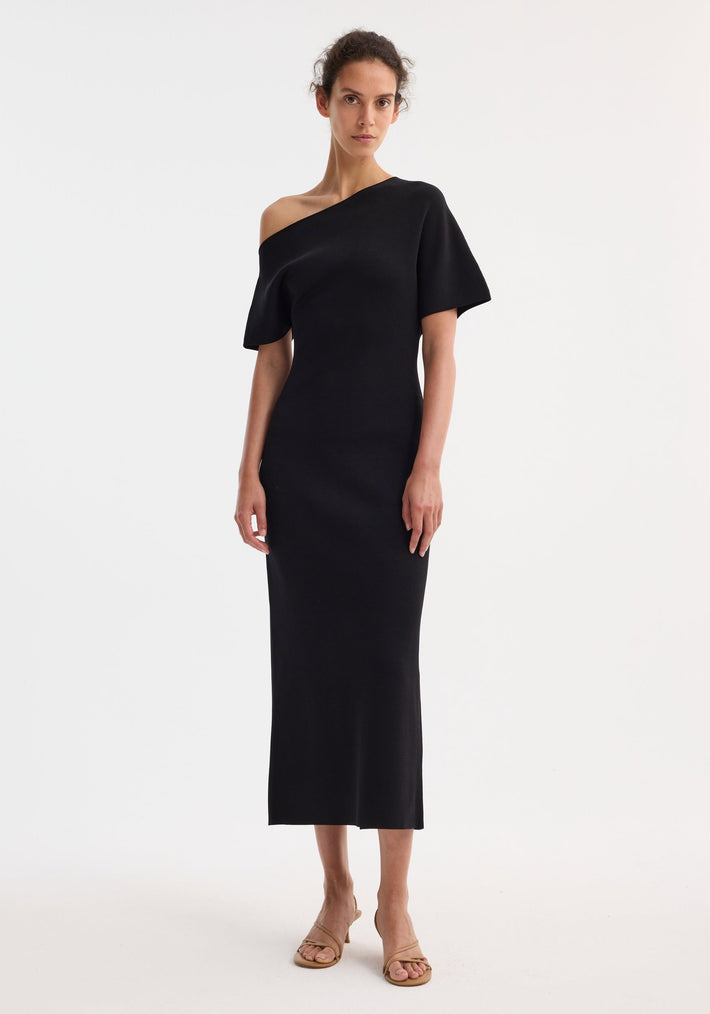 Asymmetrical knitted dress | black, showcasing elevated minimalism and quiet confidence with sculptural tailoring, intentional contrasts, and high-end craftsmanship for a timeless design and long-lasting investment.