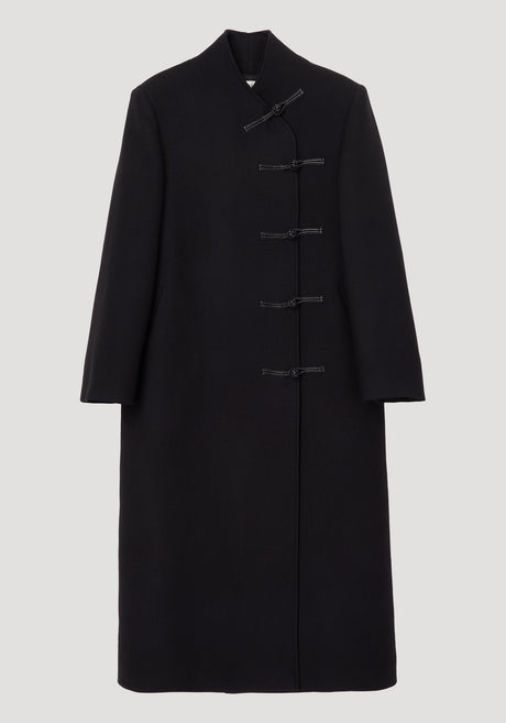 Mandarin wool coat in black featuring asymmetric mandarin closures, long length, side pockets, crafted from 100% virgin wool with a minimalist, straight silhouette.
