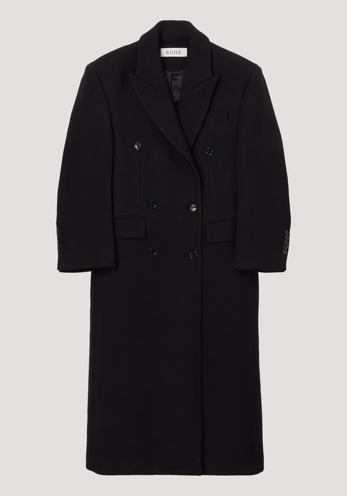Hourglass wool coat | black, featuring a long, double-breasted design with six buttons, structured shoulders, and a feminine waist. Made from 100% virgin wool.