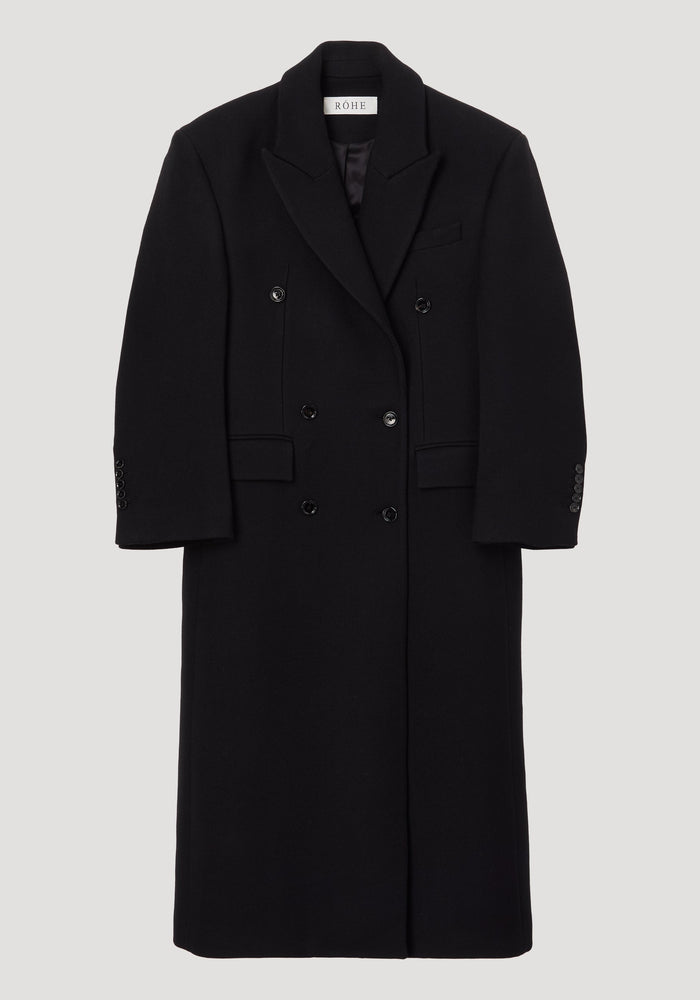 Hourglass wool coat | black, featuring a long, double-breasted design with six buttons, structured shoulders, and a feminine waist. Made from 100% virgin wool.