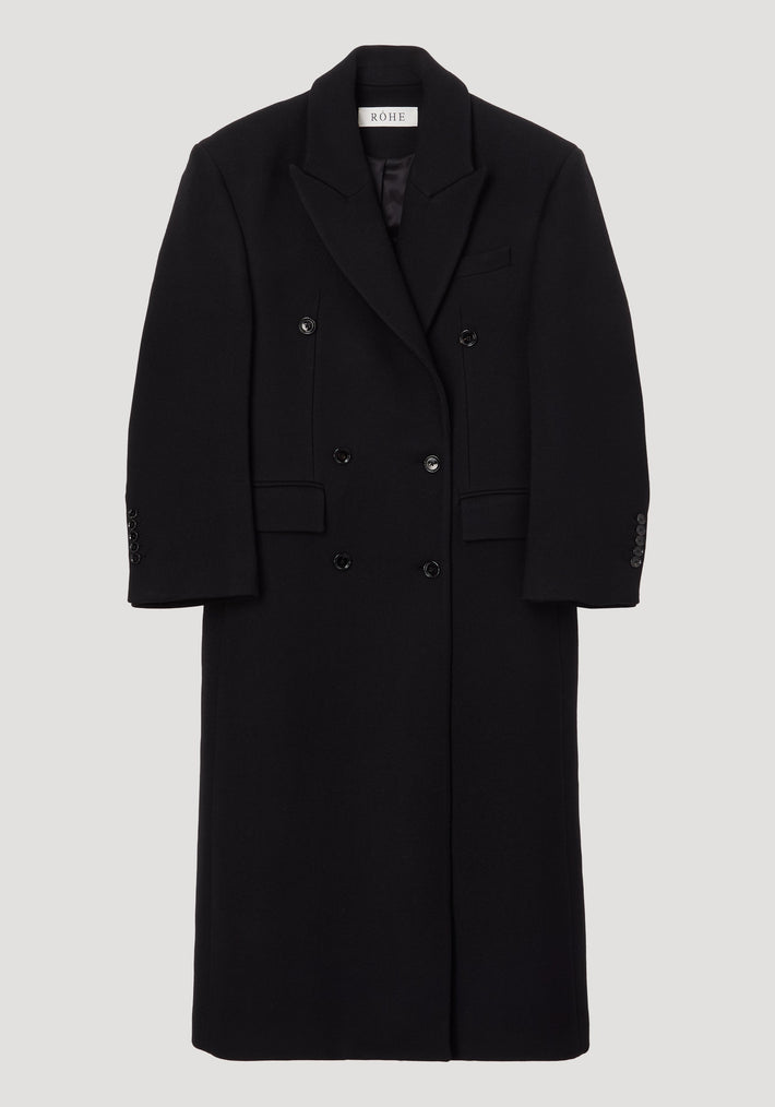 Hourglass wool coat | black, featuring a long, double-breasted design with six buttons, structured shoulders, and a feminine waist. Made from 100% virgin wool.