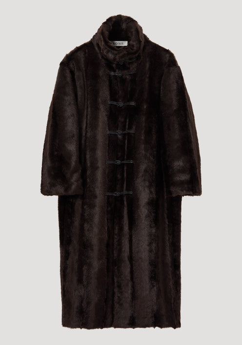 Mandarin faux fur coat in dark brown with a full-length design, stand-up collar, and five toggle-style closures, modeled in an oversized fit.