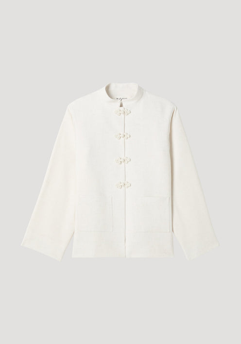 Mandarin jacket in winter white with pankou closures, square patch pockets, light silk-blend fabric, and wide sleeves; model is 179cm, wearing size EU 36.