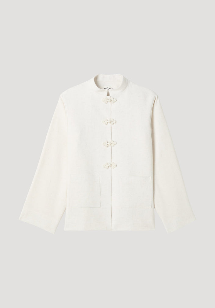 Mandarin jacket in winter white with pankou closures, square patch pockets, light silk-blend fabric, and wide sleeves; model is 179cm, wearing size EU 36.