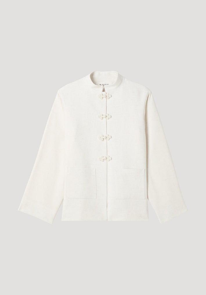 Mandarin jacket in winter white with pankou closures, square patch pockets, light silk-blend fabric, and wide sleeves; model is 179cm, wearing size EU 36.
