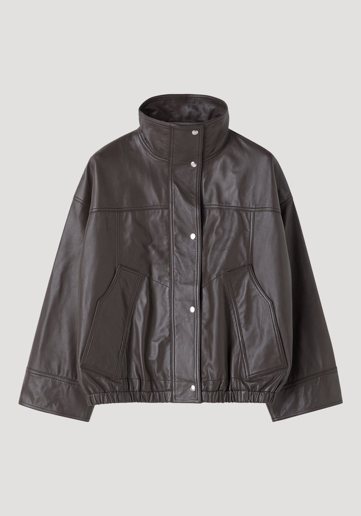 Reinvented leather jacket | earth: A minimalist bomber-style jacket with a stand-up collar, snap-button placket, oversized cut, and elasticized hem, crafted from soft leather.