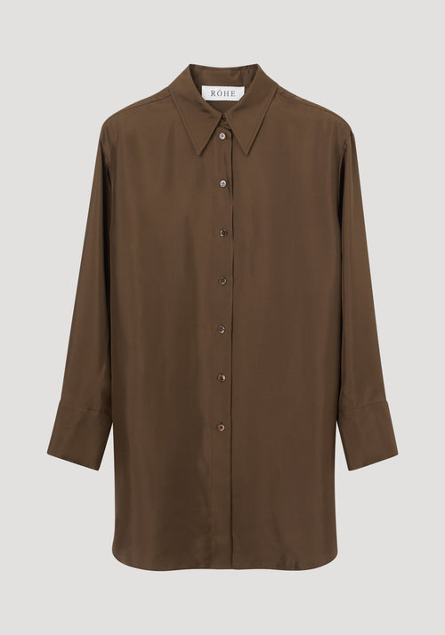 Signature elongated silk shirt | forest, featuring a rich chocolate-brown hue, oversized fit, pointed collar, button-down front, and simple cuffs. Crafted from 100% silk for elegance.