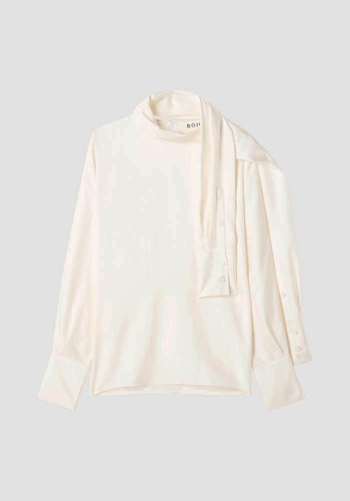 Foulard silk top | cream: Off-white blouse with draped scarf-like neck, button-cuff sleeves, and fluid silhouette. Made from pure silk, featuring RÓH label.