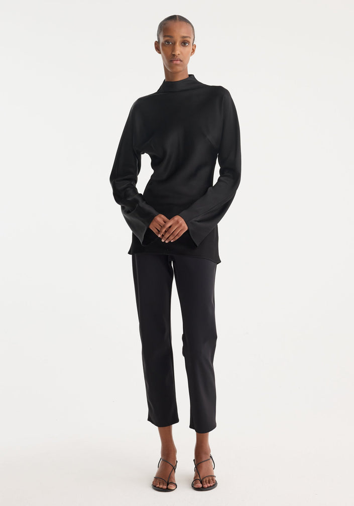 Satin waisted top | black: Fitted, long-sleeve top with mock neck, wide sleeves, and blind zip back. Smooth fabric emphasizes a minimalist, elegant silhouette.