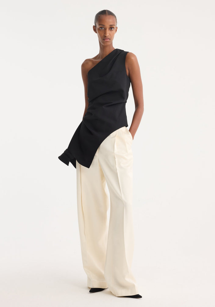 Reimagined one shoulder top | black: Black, asymmetrical top with draped detailing, fitted waist, and deconstructed upside-down collar, showcasing a unique, elegant design.