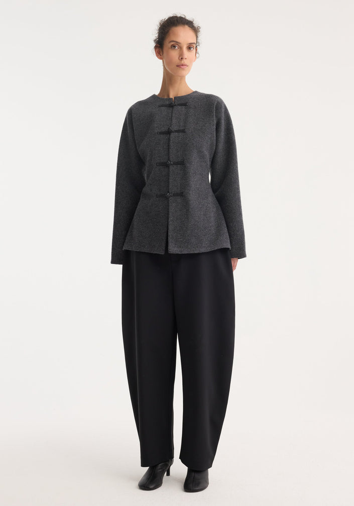 Mandarin waisted cardigan in mid grey melange, featuring a round neckline, long sleeves, and leather frog-style closures, laid flat on a neutral background.