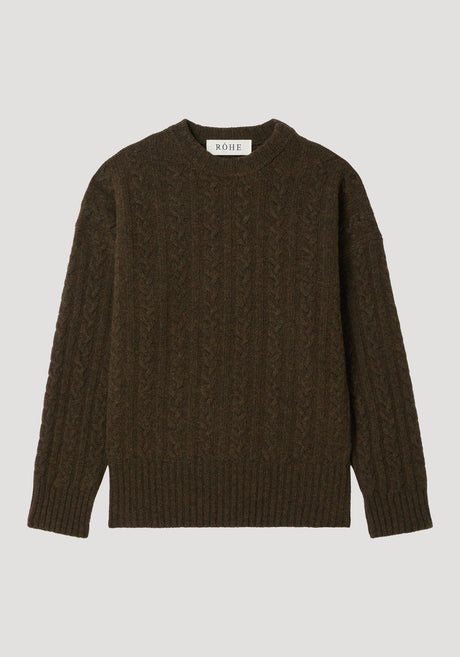 Cable knit jumper in forest melange, showcasing a dark olive-brown, cable-knit pattern, oversized fit with dropped shoulders, crew neckline, and brand label at the neck.