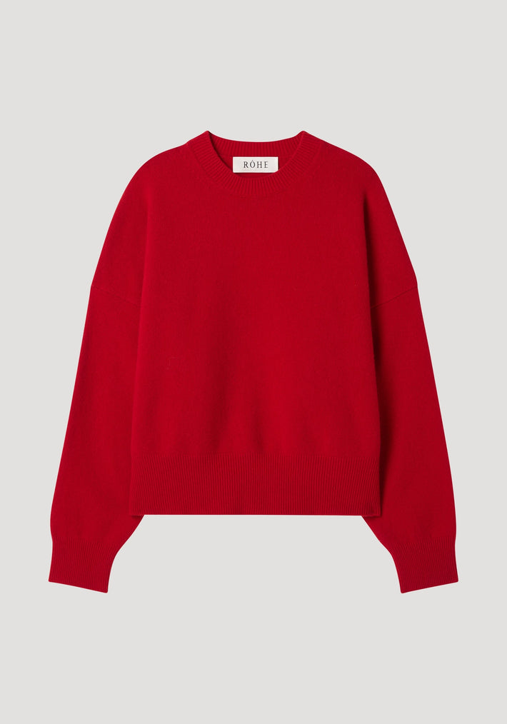 Boiled wool crewneck | rosso: Plain red, long-sleeved crewneck sweater with relaxed fit, drop shoulders, crafted in superfine wool, displayed flat with a RÔHE neck tag.
