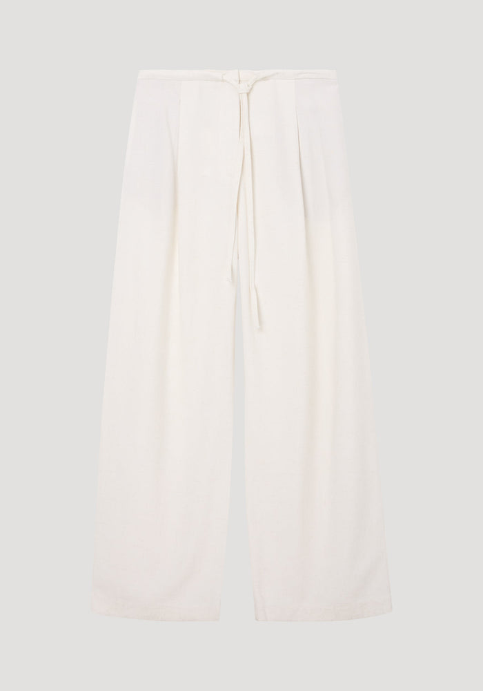 Relaxed drawstring trousers in winter white, featuring a wide-leg silhouette, lightweight silk-blend fabric, drawstring waistband, and subtle pleating for effortless movement.
