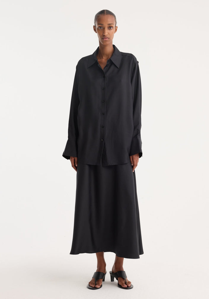 Silk gilet-dress | black: A sleeveless, button-front blouse with a knotted waist detail over a floor-length skirt, crafted from fluid 100% silk.