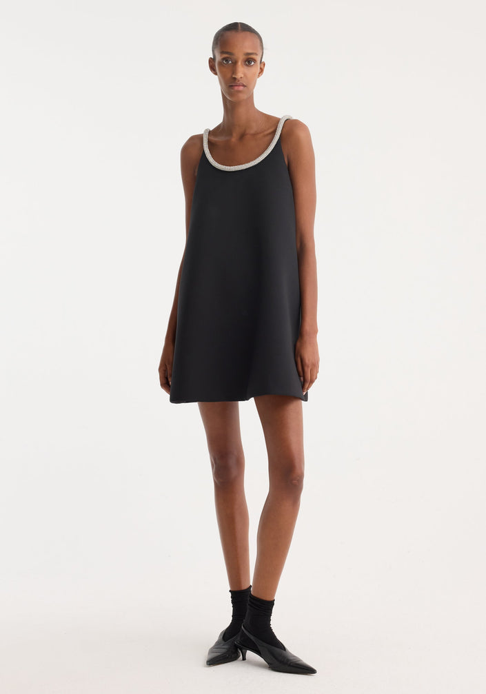 A-line appliqué dress | black with spaghetti straps, scooped crystal-trimmed neckline, loose silhouette, bonded wool blend, and visible ROHE label at the back.