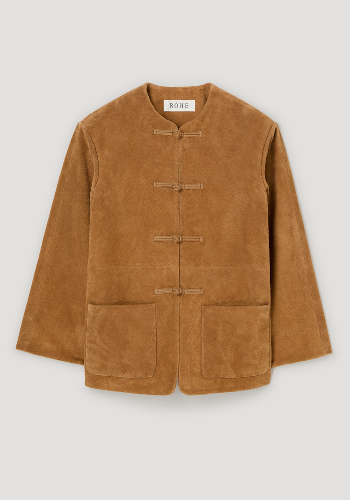 Pankou closure suede jacket | cognac laid flat, featuring frog-style toggle closures, collarless neckline, embroidered edges, and patch pockets, crafted from 100% cow leather.