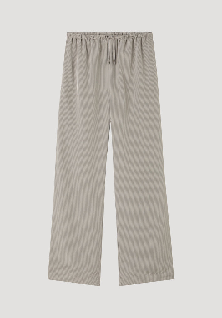 Relaxed fit trousers in light grey stripes featuring a wide-leg design, elastic drawstring waistband, and side seam pockets, crafted from soft viscose for everyday wear.