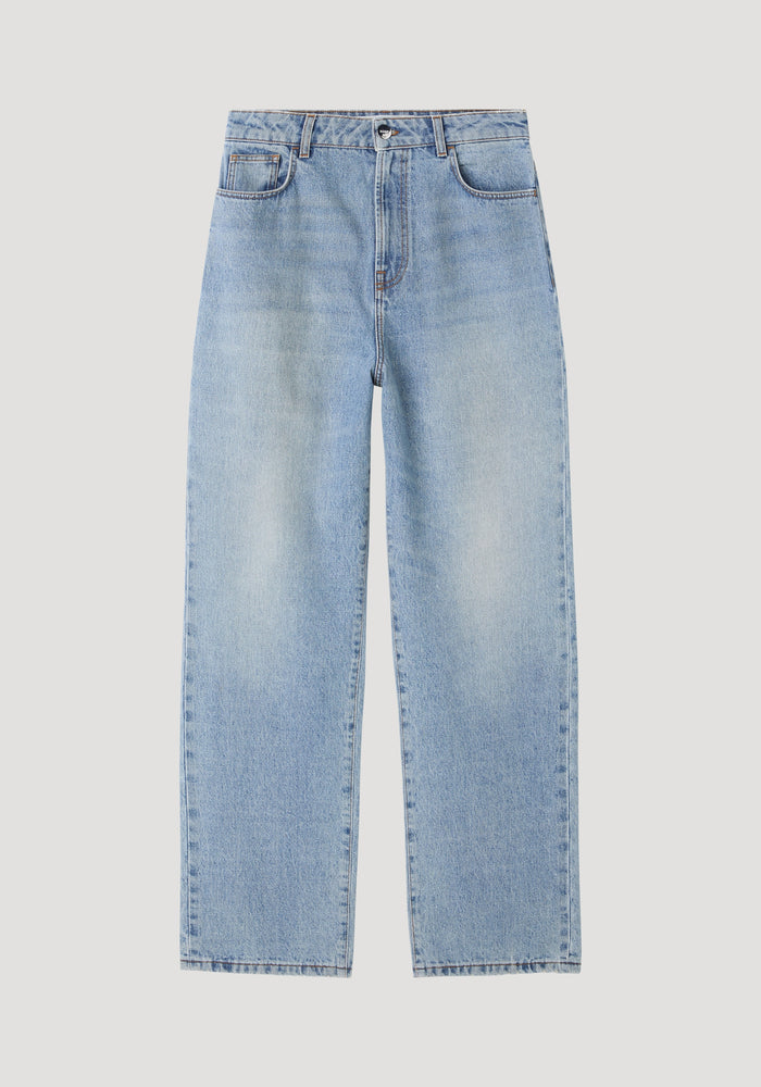 Baggy fit denim in classic blue, showcasing a low-waist, wide-leg style with five-pocket design, button-and-zip fly, and subtle faded detailing.