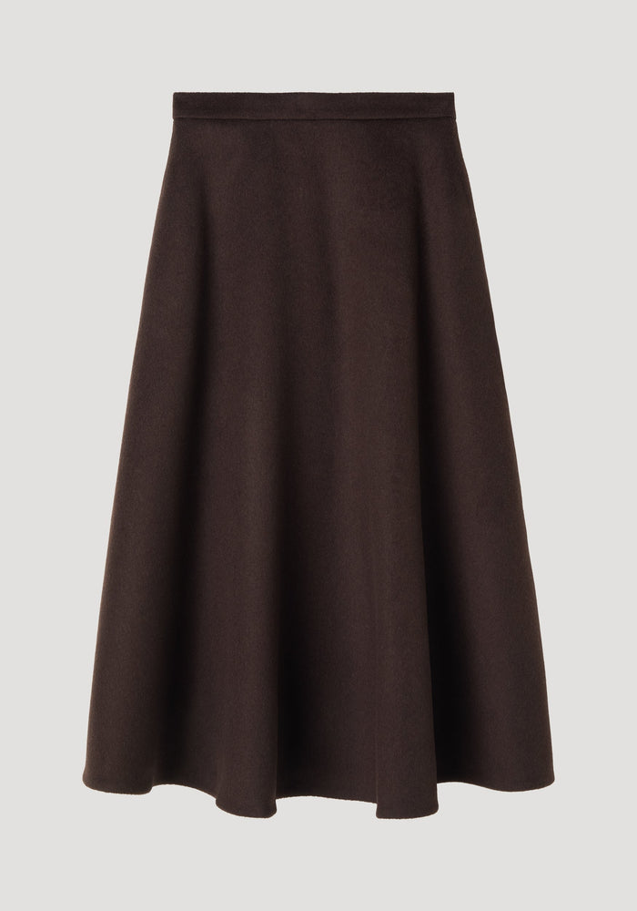 A-line skirt in dark brown, featuring a midi-length voluminous silhouette, side pockets, and seamless zipper closure, crafted from recycled wool blend.