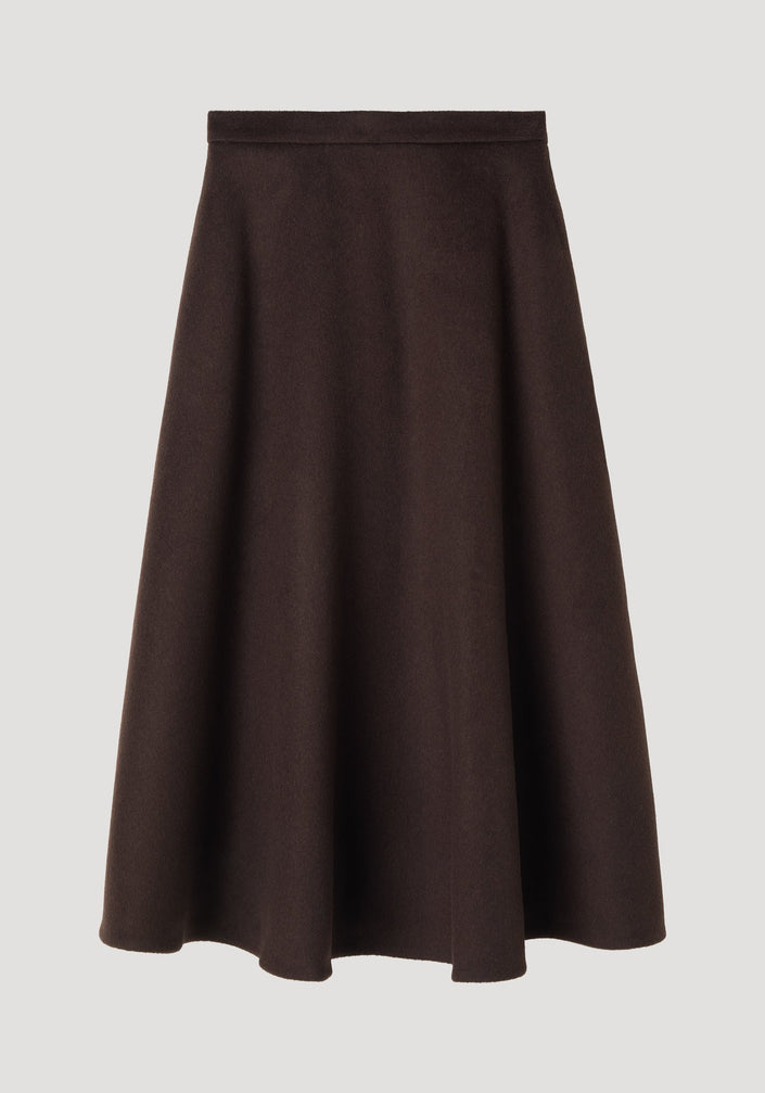 A-line skirt in dark brown, featuring a midi-length voluminous silhouette, side pockets, and seamless zipper closure, crafted from recycled wool blend.