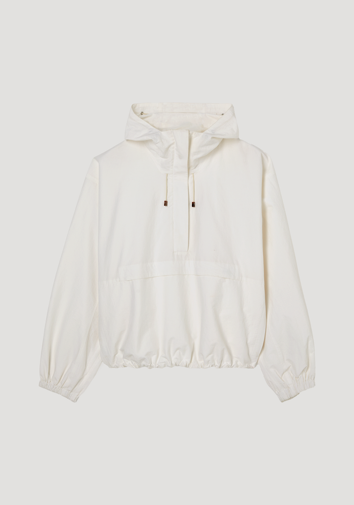 Textured cotton-blend anorak in optic white with hood, features a partial zip, front and side zip pockets, and adjustable drawcords for added function.