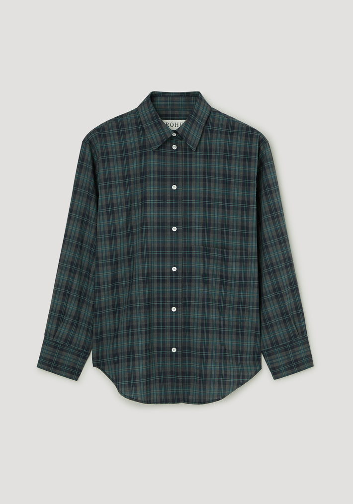 Oversized check shirt in retro green check features a classic pointed collar, white buttons, chest pocket, and relaxed fit in dark plaid fabric.