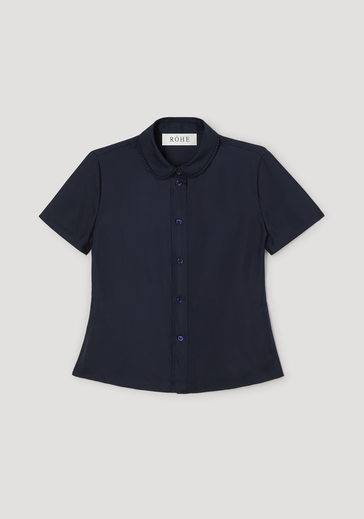 Embroidered silk fitted shirt | night, showcasing a navy, short-sleeve blouse with a Peter Pan collar and delicate embroidery, laid flat with visible RÓHE label.