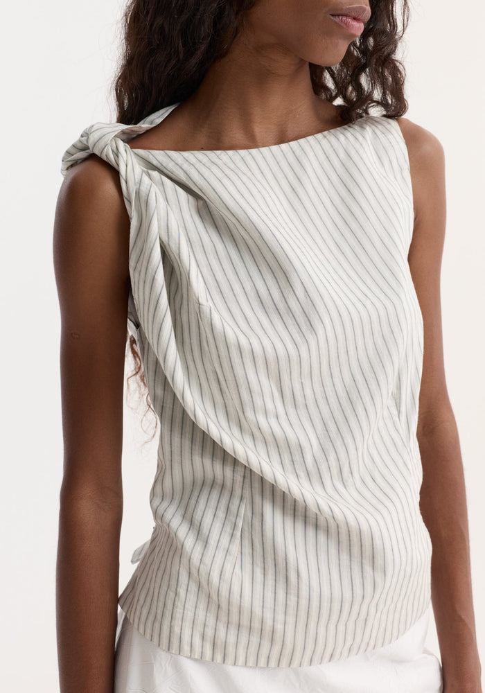 Silk-blend draped top with fine stripes, featuring an asymmetrical boat neck and twist detail on one shoulder, creating a fluid silhouette.