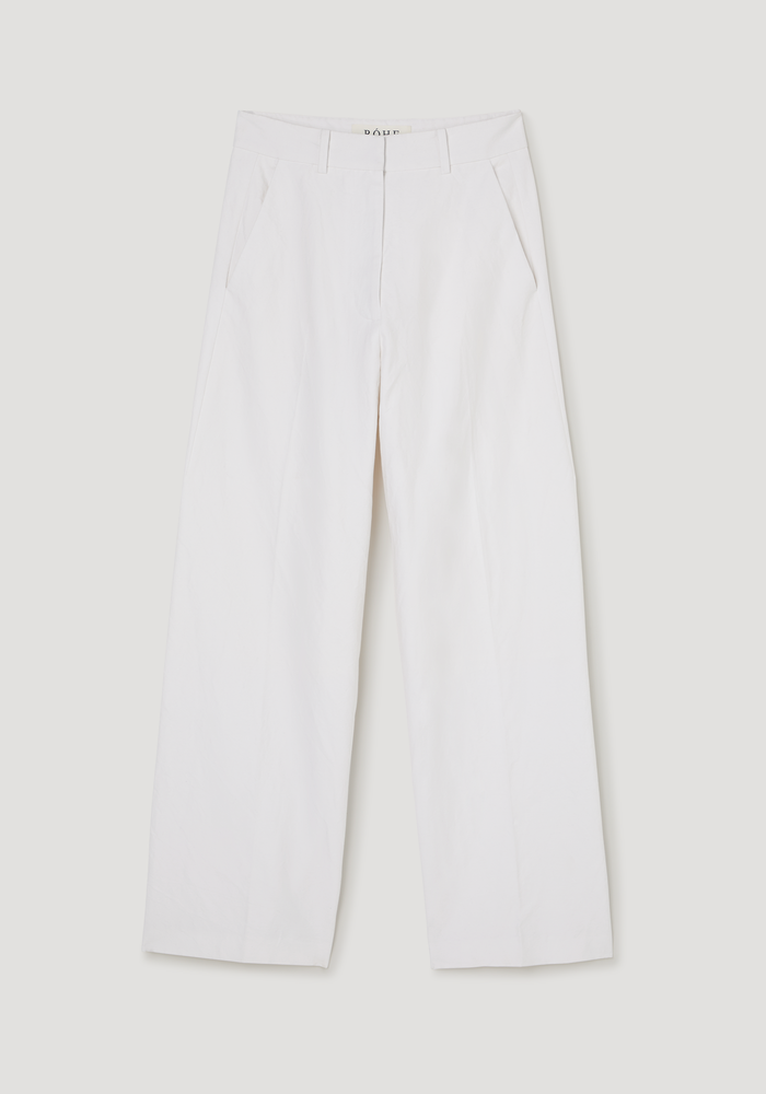 Classic baggy chino in optic white, featuring a wide-leg design, laid flat to showcase its relaxed fit and versatile style against a neutral backdrop.