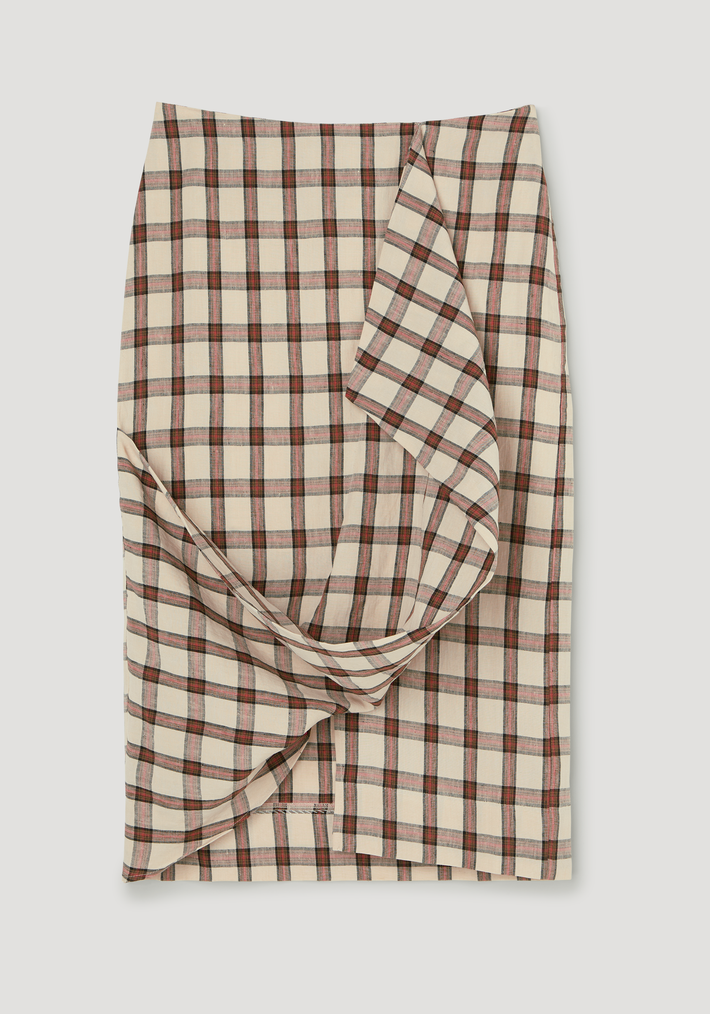 Draped check skirt | red table check: Knee-length wrap skirt with asymmetric drape, featuring red/black/olive plaid pattern, crafted from 100% linen for a structured yet soft look.