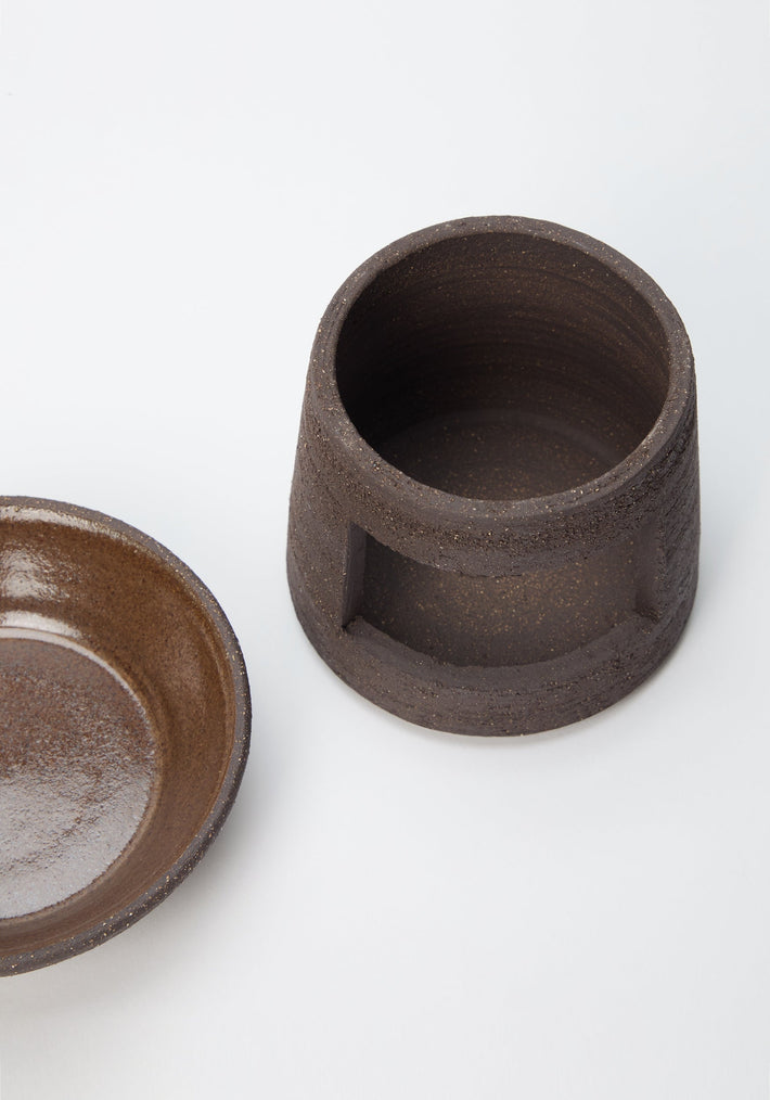 Ceramic Oil Burner | soil: Handmade brown ceramic vessel and matching dish, featuring a speckled texture and cut-out design, ideal for diffusing Róhe’s Diplomatico Burner Oil.