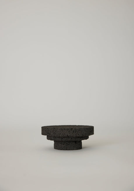 Elevated Sculptural Tray crafted from porous lava stone, featuring three stacked discs, showcasing a unique, handcrafted design by Dutch artist Louis Crombag.