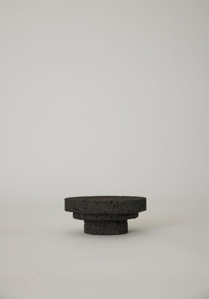 Elevated Sculptural Tray crafted from porous lava stone, featuring three stacked discs, showcasing a unique, handcrafted design by Dutch artist Louis Crombag.