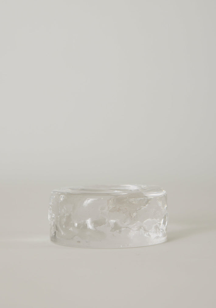 Presse-papier & holder: A translucent, low-profile glass cylinder with a rippled finish, resembling a minimalistic paperweight, handcrafted by Szkło Studio.