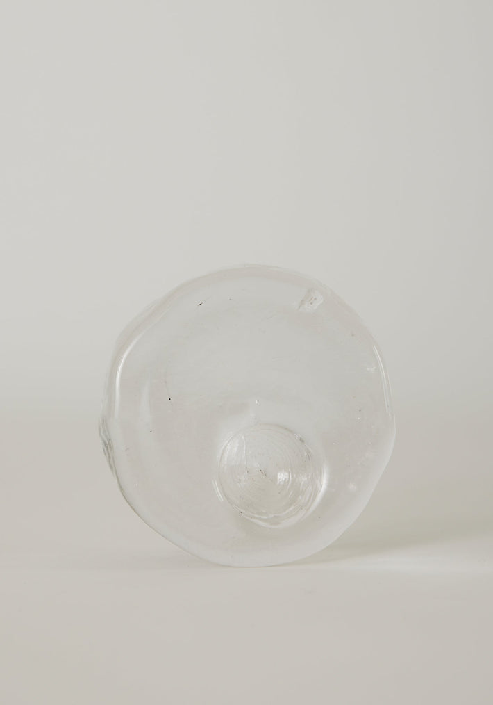 Presse-papier & holder | Glass: Hand-blown, transparent glass object with wavy edges and a central dome, showcasing Szkło Studio's unique, functional glass artistry.